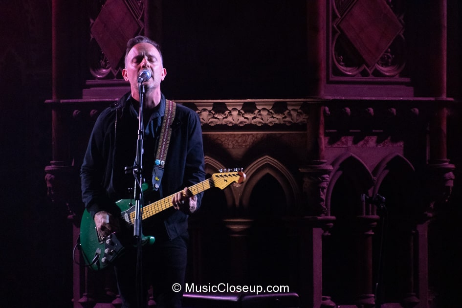 Dave Hause playing a green electric guitar