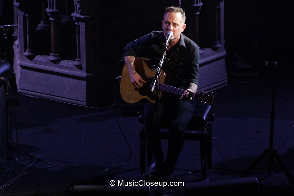 Dave Hause playing electro-acoustic guitar