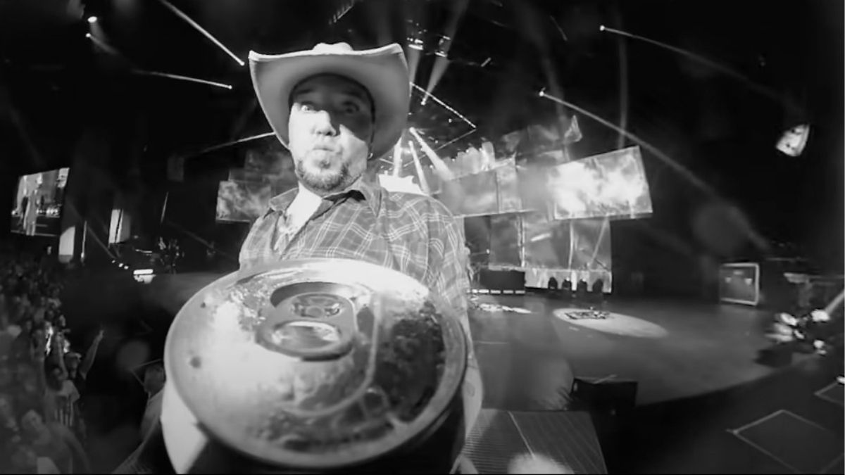Jason Aldean opening a can in Get Back video