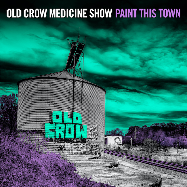 Old Crow Medicine Show Paint This Town album cover - a neon-tinged photo of an old gas holder graffitied with the words 'Old Crow'