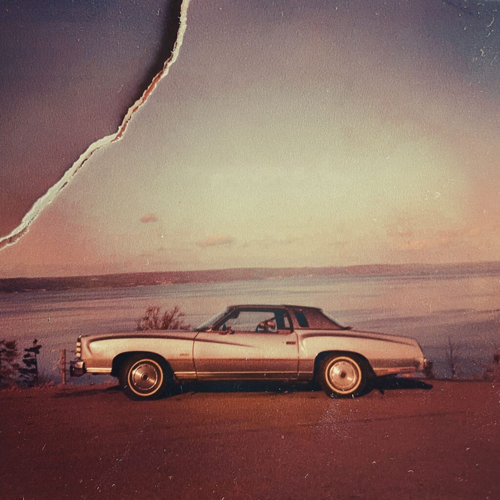Loss: torn photo of a '77 Monte Carlo car