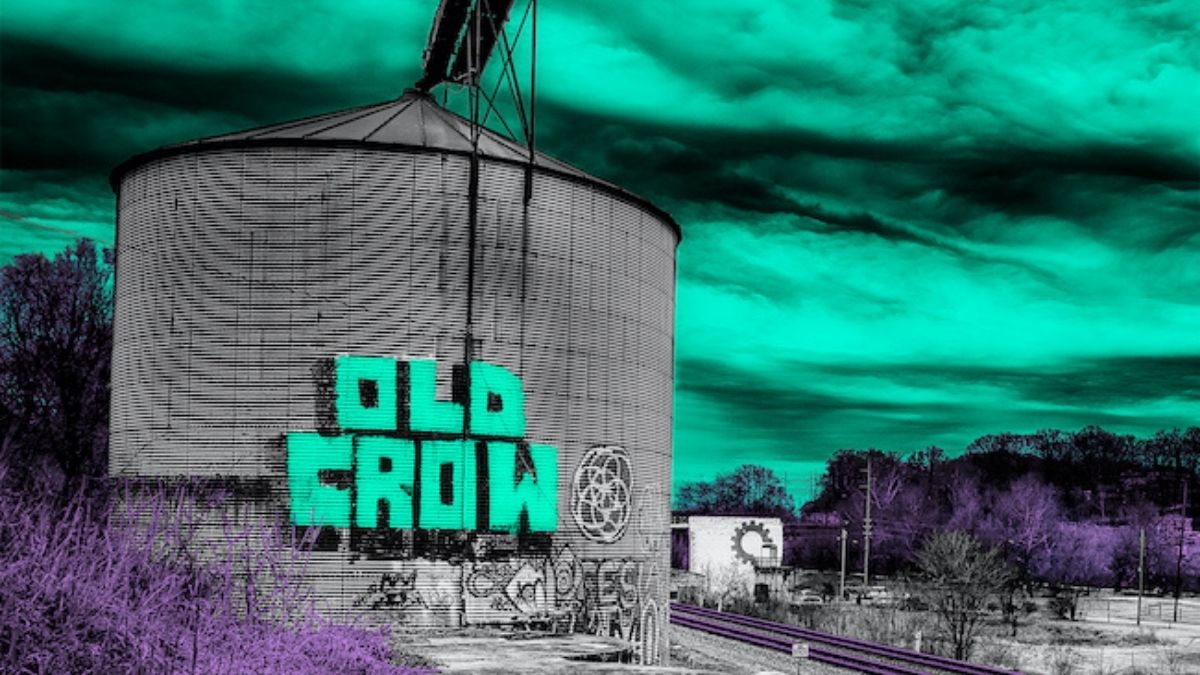 Old Crow Medicine Show Paint This Town album cover - Old Crow graffiti on an old gas holder
