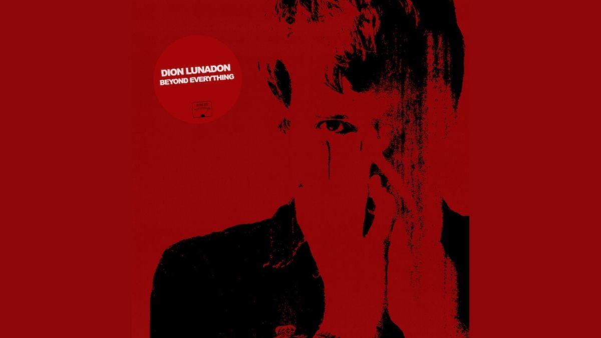 Dion Lunadon album cover - red-tinged photograph of Dion holding his hands to his face