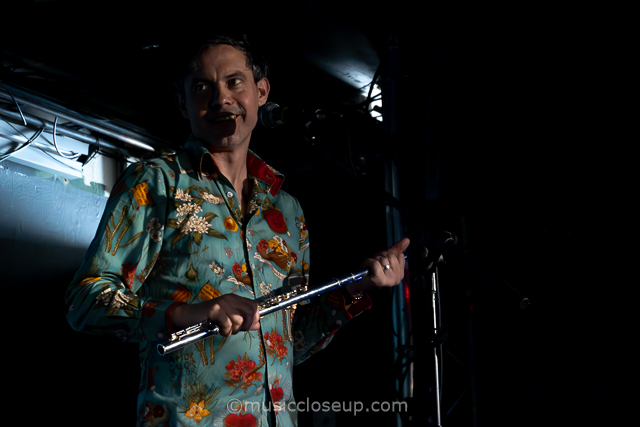 Bennett Wilson Band live in Glasgow: Robin Bennett smiling while holding a flute