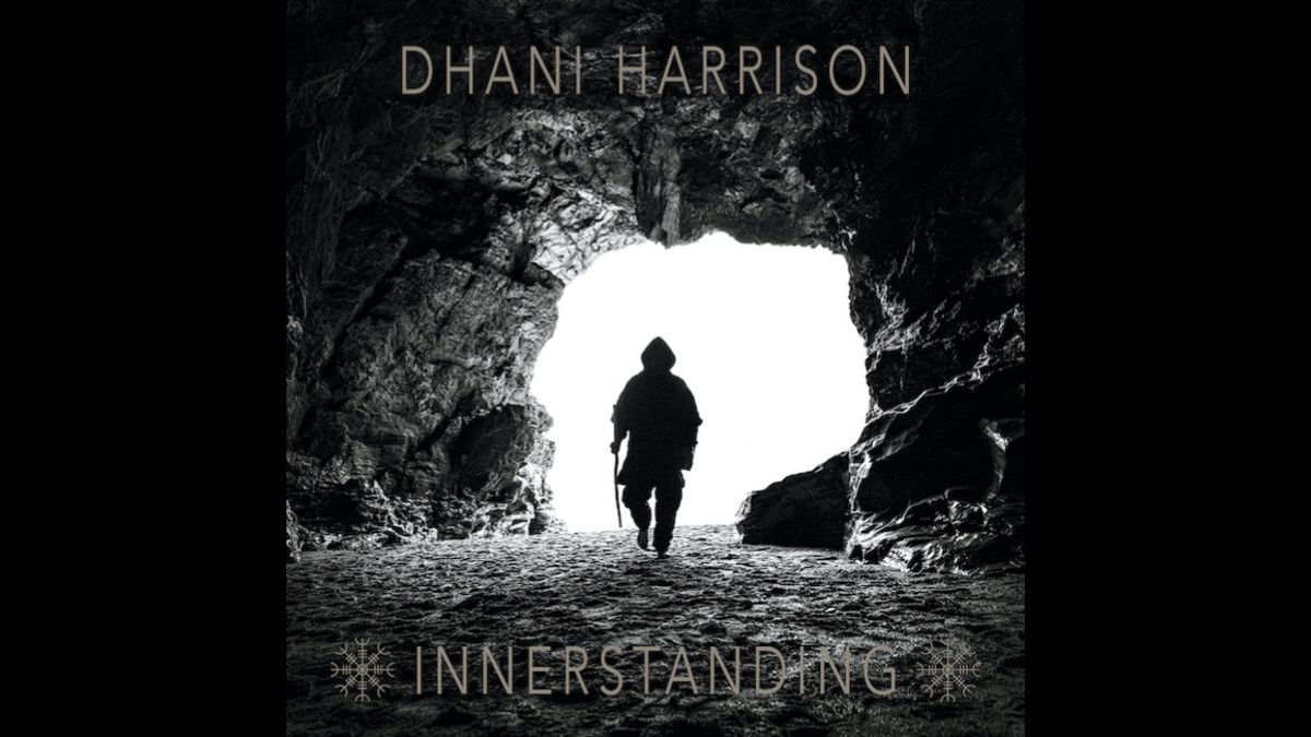 Innerstanding Dhani Harrison album cover: black and white photo showing the silhouette of a hooded man walking into a cave