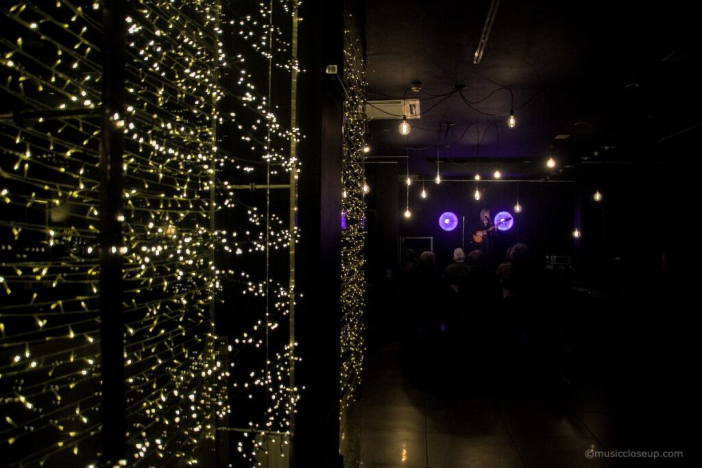 Emily Barker live in Dumfries: a curtain wall of twinkling LED lights leading to a stage in the distance