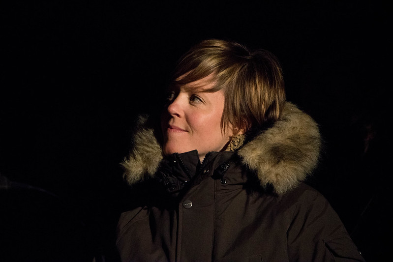 Emily Barker wearing a big coat with a large fake fur hood