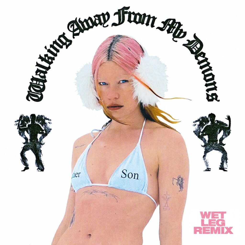 Faux Real Wet Leg remix image: a photo of a woman with pink hair wearing fluffy white earmuffs and a bikini