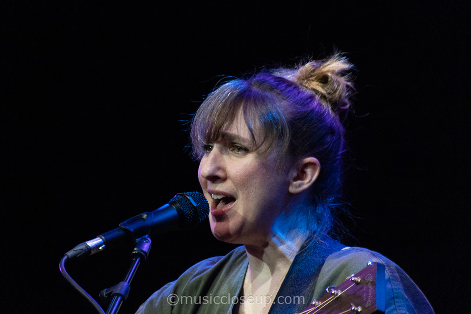 A close-up of Annie Dressner singing