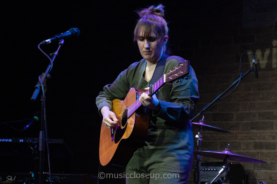 Annie Dressner playing guitar
