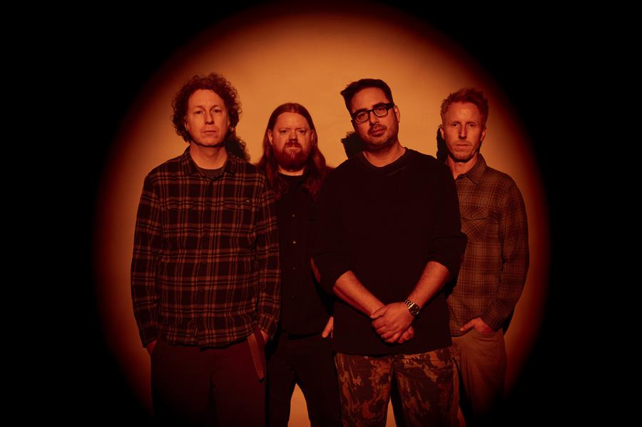 Hundred Reasons photographed in a red spotlight