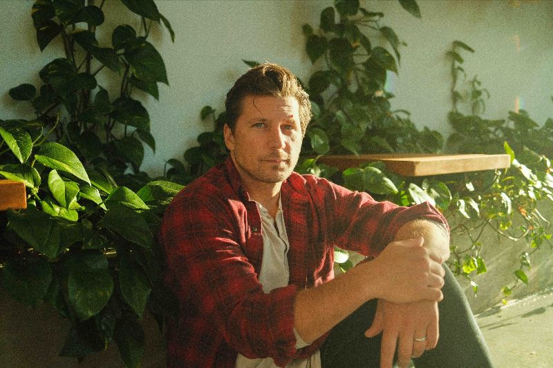 Ace Enders wearing a red plaid shirt